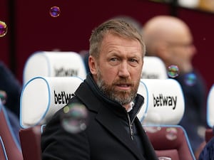 Graham Potter sat in the dugout