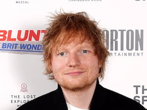 Headshot of Ed Sheeran smiling