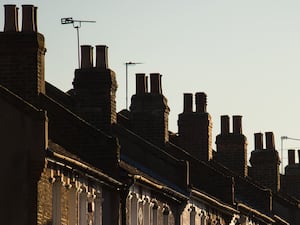 Chimneys on a row of terraced houses