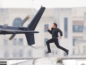 Tom Cruise runs along Blackfriars Bridge in London,