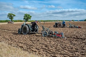 Tractors plowing 