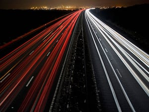 Light Trails on the M4 Motorway neat Port Talbot in South Wales with Port Talbot Steel Works lighting up the distance.