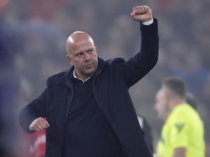 Liverpool manager Arne Slot clenches his fist as he celebrate victory over Leicester