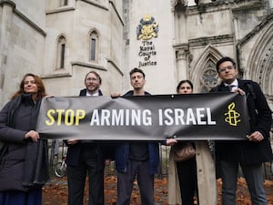 Campaigners outside the High Court in London where Al-Haq is taking legal action against the Department for Business and Trade over decisions not to suspend licences for the export of weapons and military equipment to Israel