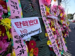 A row of wreaths outside the Constitutional Court in Seoul