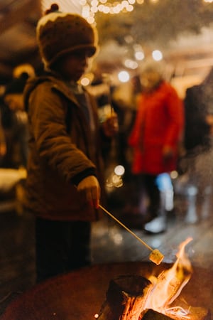 The family can toast marshmallows on the fire as Santa shares stories