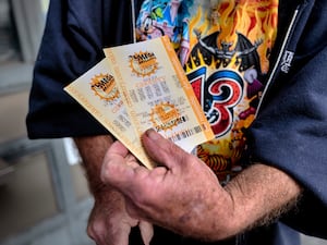 Lottery tickets in a man's hand