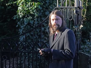 A bearded man walking in to Durham Crown Court