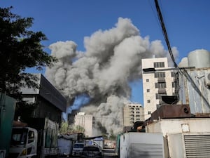 Smoke rises from a building that collapsed following an Israeli air strike in Chiyah, south of Beirut