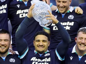 Sione Tuipulotu holds the Hopetoun Cup aloft