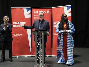 Sir Keir Starmer gives a speech at a reception at the Labour Party conference, flanked by Dawn Butler and Sadiq Khan