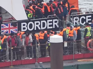 A Border Force vessel brings a group of people thought to be migrants in to Dover