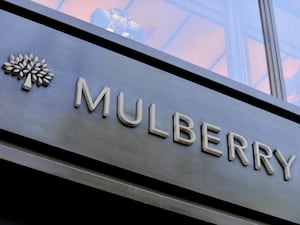 The tree logo and name on a brown Mulberry shopfront