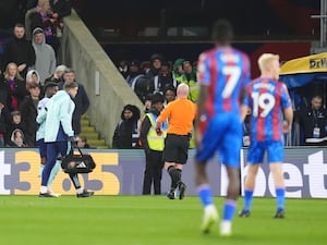 Bukayo Saka, left, goes off injured