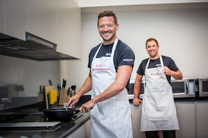 Dr James Mercer and critical care paramedic, Ryan Ferris model the new Rapid Response aprons.