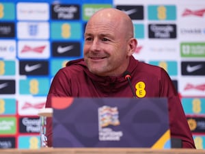 Lee Carsley smiles during a press conference