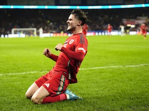 Liam Cullen celebrates scoring for Wales against Iceland