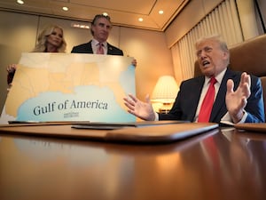 President Donald Trump speaks to reporters accompanied by Interior Secretary Doug Burgum and his wife Kathryn Burgum, aboard Air Force One