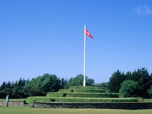 A flag flying at Tynwald Hill at St Johns on the Isle of Man