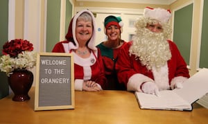 Santa, Mrs Christmas and Emma Elf check bookings ahead of their visit to Derwen Christmas Fayre.