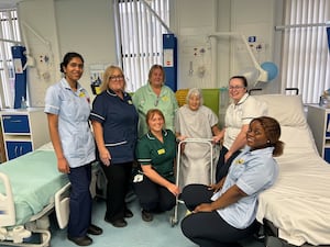 The first patient Gloria Malpass-Leek with members of staff on Ward Five.