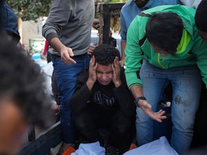 Palestinians mourn their relatives