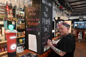 Philippa Davies writes up the beer list, which is a mixture of staple beers and guests