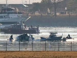 Search and rescue efforts (Mark Schiefelbein/AP)