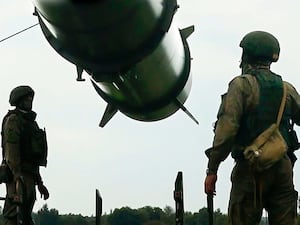 Russian soldiers load a Iskander-M short-range ballistic missile launcher as part of Russian military drill intended to train troops in using tactical nuclear weapons