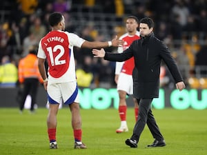 Arsenal’s Jurrien Timber and manager Mikel Arteta after their win at Wolves