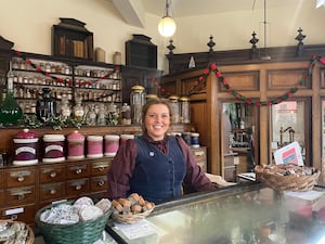 Jess Hodgkiss, Visitor Engagement Team Leader at Blists Hill Victorian Town, in the chemist dressed for Christmas. 