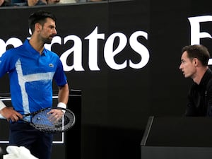 Novak Djokovic, left, talks to coach Andy Murray