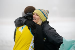 Tim Stevens celebrates with Nicky Green from Severn Hospice after finishing his marathon challenge. Picture: Jamie Ricketts