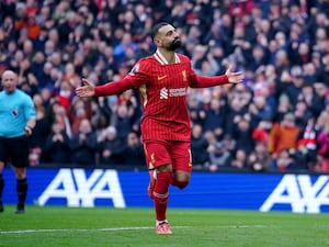 Mohamed Salah celebrates scoring against Wolves