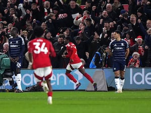 Nottingham Forest forward Anthony Elanga, centre, celebrates his late winner at the City Ground