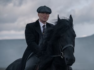 Cillian Murphy riding a horse as Tommy Shelby in Peaky Blinders