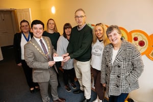 A cheque is handed over to Action For Children in Shrewsbury, presented by Deputy Mayor Alex Wagner.  