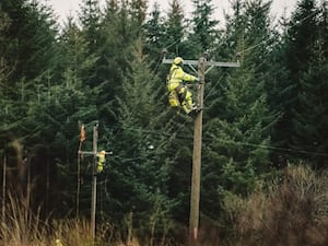 Engineers repairing overhead wires