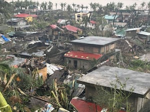 Damaged houses caused by Typhoon Man-yi in the north-eastern Philippines