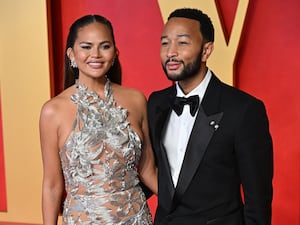 Chrissy Teigen and John Legend dressed for a red carpet event