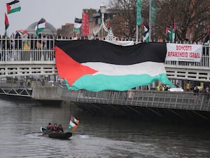 NUJ members hold a vigil on Dublin’s Ha’penny Bridge in protest at the killings of journalists in Gaza