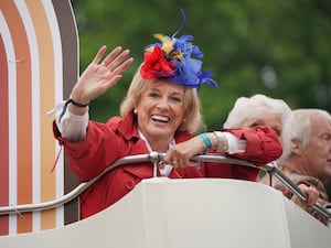 Dame Esther Rantzen waves from a bus during the Platinum Jubilee Pageant in London in June 2022