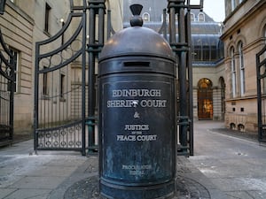 View of a pillar box reading Edinburgh Sheriff Court