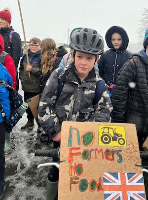 Dougie Powell, eight, leading his farmers mini-march in Presteigne