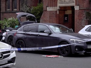 A car at the scene of a hit-and-run incident at the junction of Regent’s Park Road and Primrose Hill in north London