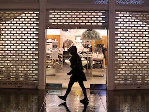 A shopfront with the shutters pulled down