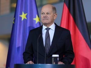 Olaf Scholz appears after making the formal announcement