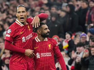 Virgil Van Dijk, left, celebrates with Mohamed Salah (Jon Super/AP)