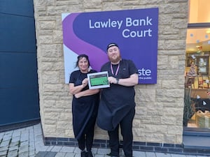 Carol Overton and Keith Robinson, members of the Lawley Bank Court kitchen team, proudly display their ‘five’ food hygiene rating certificate.