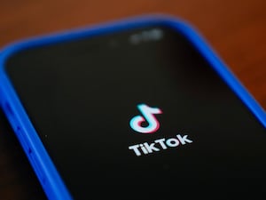 TikTok logo on a phone